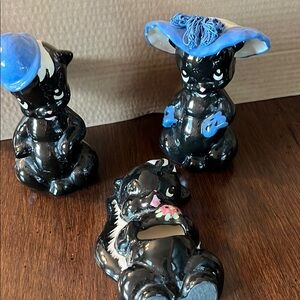 skunk candle stick holders and toothpick holder.